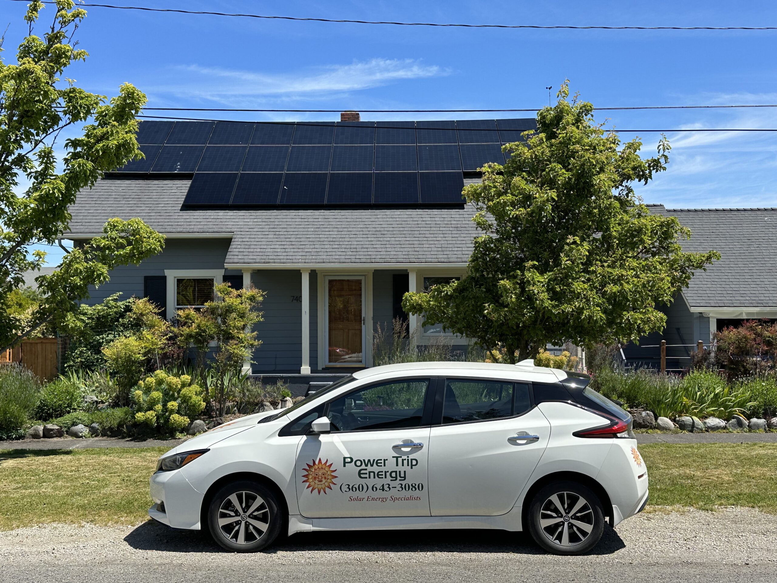 EV Car in front of home with SunPower solar array
